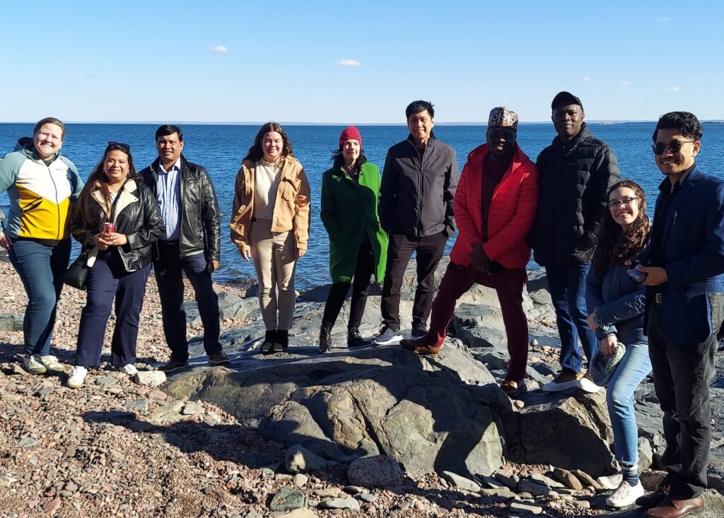 Students and staff from Luther Seminary on the shore of Lake Superior near Duluth