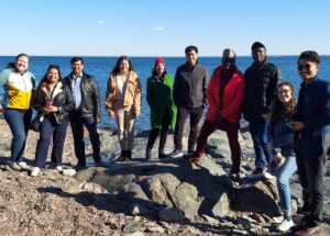 Students and staff from Luther Seminary on the shore of Lake Superior near Duluth