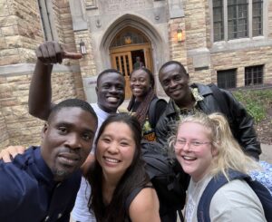 Kristy Hu with classmates in front of the Luther Seminary library