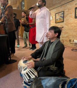 Saleem Akhtar, M.Th. student at Luther Seminary, plays the tabla with other students during the seminary's annual Agape Feast.