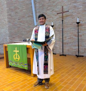 Saleem Akhtar, M.Th. student at Luther Seminary, serving as Holy Communion celebrant during chapel worship.